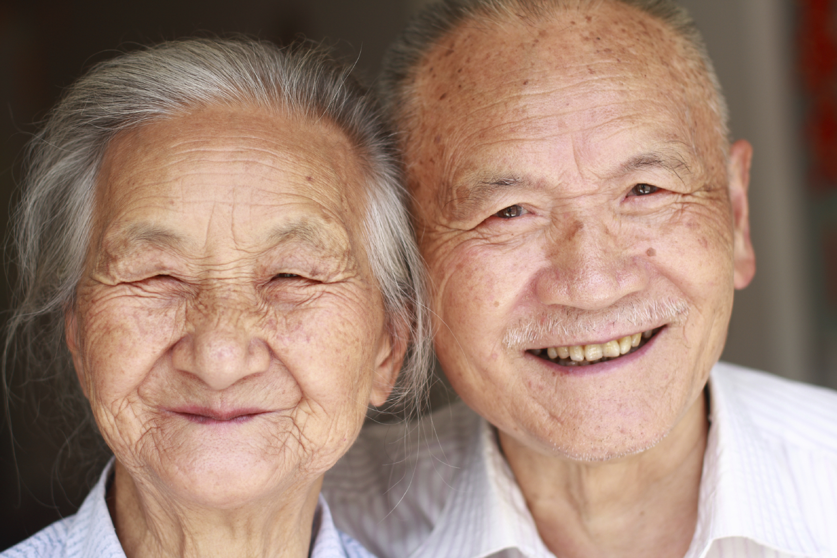 Close up image of Asian older adult couple.